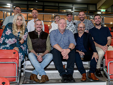 A group of adult seated together at ENGIE Stadium during Sydney Royal Easter Show's Evening Entertainment event.
